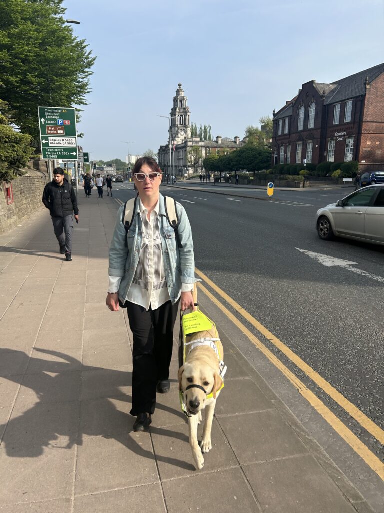 Nina walking with Donny up a busy road.